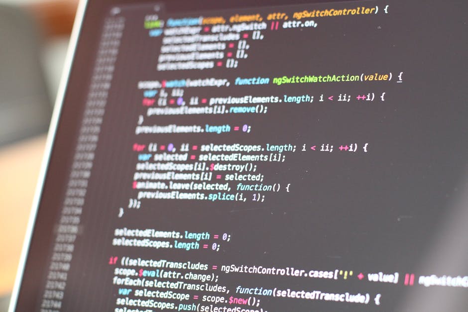 A close-up of a computer screen displaying colorful lines of code, featuring syntax highlighted text in green, pink, blue, and yellow on a dark background. The code appears to be related to programmin